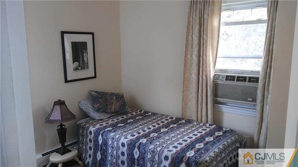 522 Crows Mill Road Fords, NJ 08863 - Photo 4 of 14 a bedroom with a bed and a window