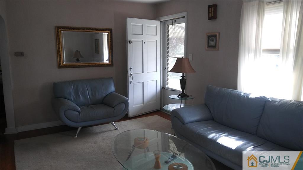522 Crows Mill Road Fords, NJ 08863 - Photo 7 of 14 a living room with furniture and a window