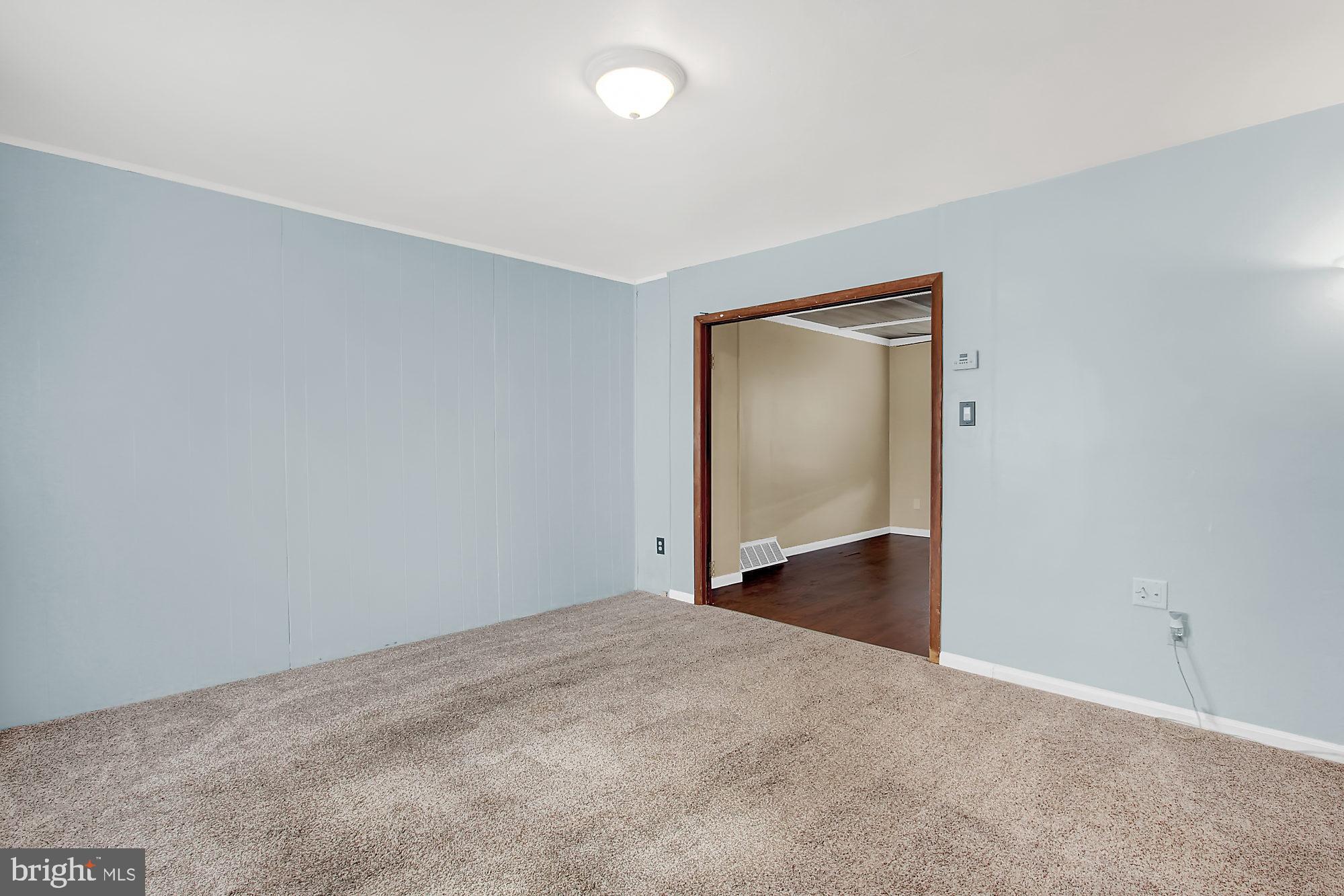 9724 Matzon Road Baltimore, MD 21220 - Photo 12 of 26 Large family room leading to dining room