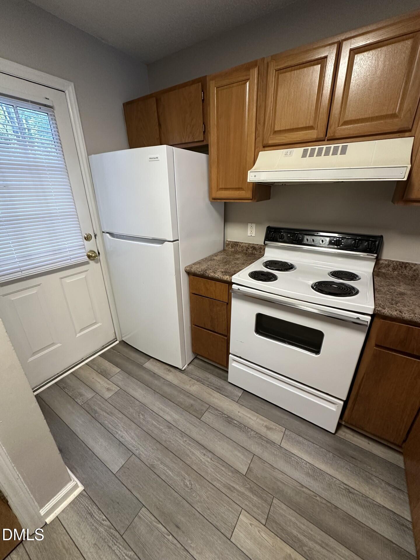 2904 Faversham Place Raleigh, NC 27604 - Photo 5 of 9 a white stove top oven sitting inside of a kitchen
