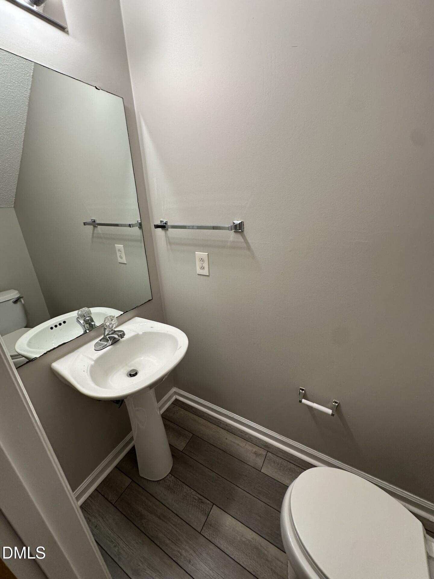 2904 Faversham Place Raleigh, NC 27604 - Photo 6 of 9 a bathroom with a sink mirror and toilet