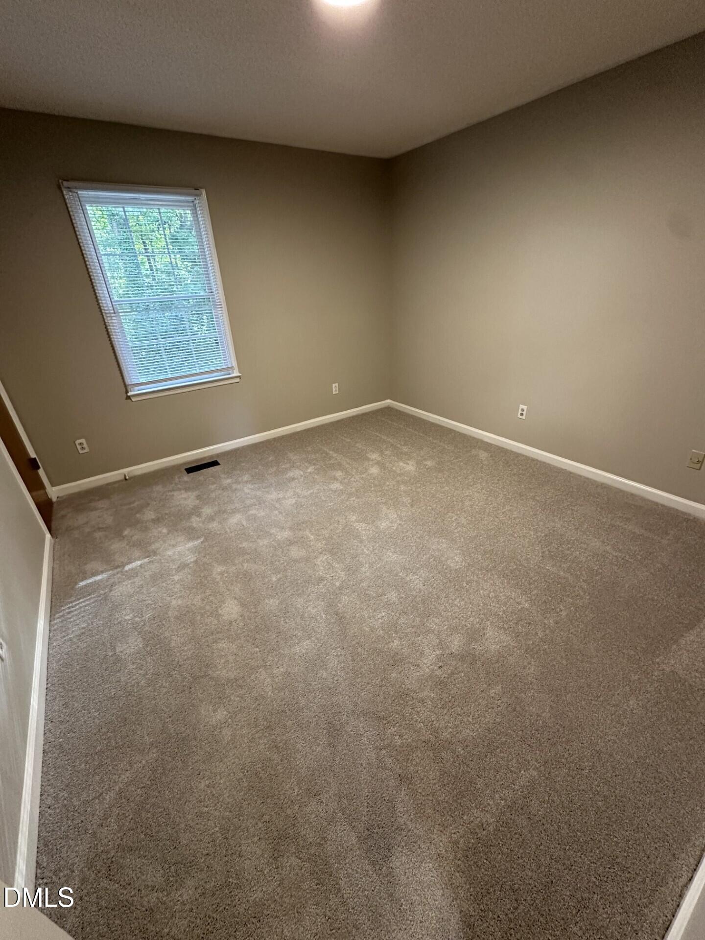 2904 Faversham Place Raleigh, NC 27604 - Photo 9 of 9 an empty room with a window