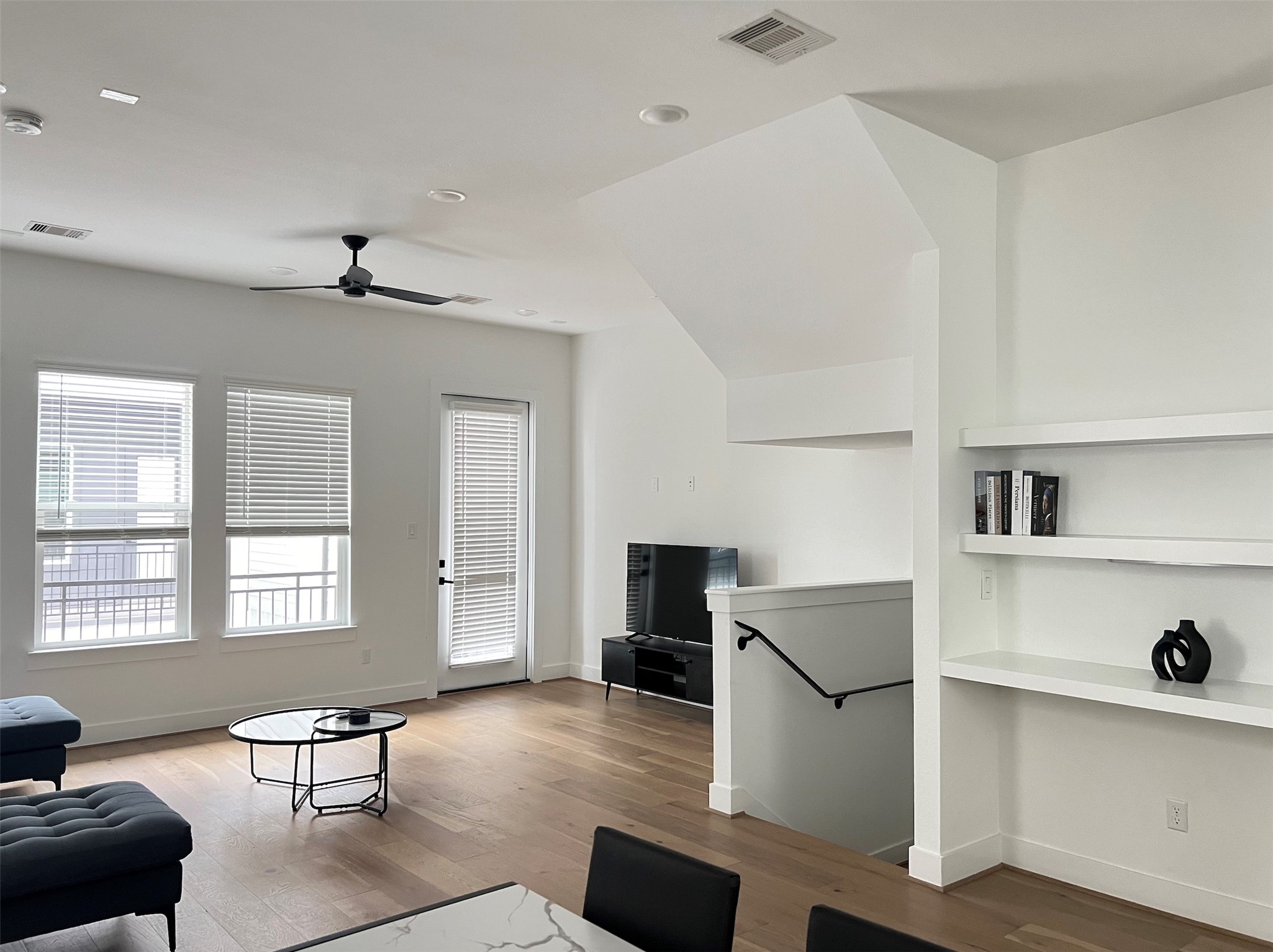 316 Thornton Road, Unit D Houston, TX 77018 - Photo 6 of 8 a living room with furniture cabinets and a table