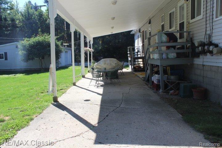 11161 Hall Road Whitmore Lake, MI 48189 - Photo 7 of 24 COVERED BACK PORCH