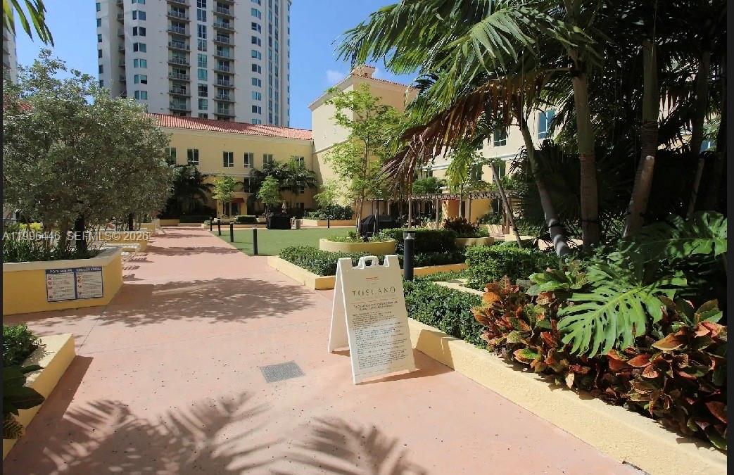 7350 Southwest 89th Street, Unit 1102S Miami, FL 33156 - Photo 2 of 30 a view of a yard with plants and trees