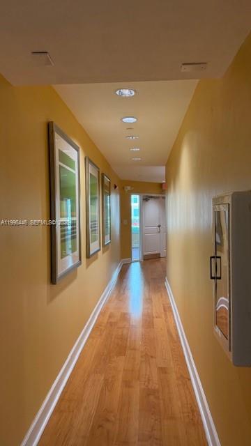 7350 Southwest 89th Street, Unit 1102S Miami, FL 33156 - Photo 26 of 30 a view of hallway with wooden floor
