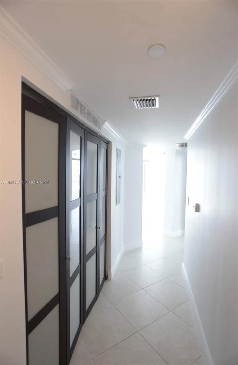 7350 Southwest 89th Street, Unit 1102S Miami, FL 33156 - Photo 27 of 30 a view of a hallway with closet and a bathroom