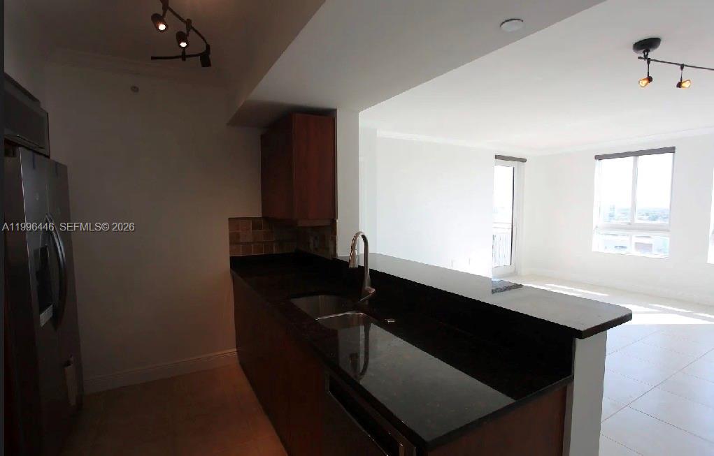 7350 Southwest 89th Street, Unit 1102S Miami, FL 33156 - Photo 28 of 30 a bathroom with a sink and a mirror