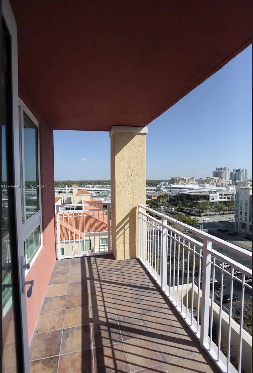 7350 Southwest 89th Street, Unit 1102S Miami, FL 33156 - Photo 4 of 30 a view of balcony with furniture