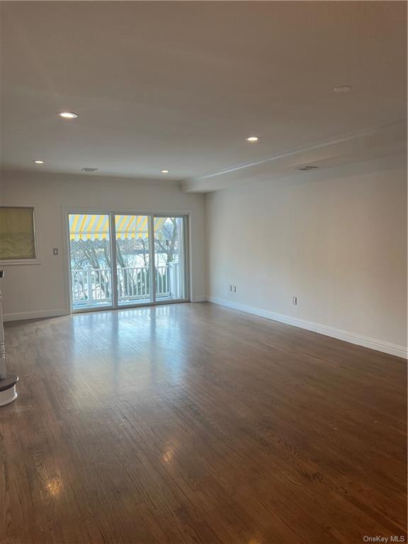 240-250 Pelham Road New Rochelle, NY 10805 - Photo 13 of 36 Another view of the Living Room leading to the expansive Trex Deck. You'll marvel at these sumptuous, walnut stained, hardwood floors! This is a view of the cavernous living room that leads to the huge terrace that overlooks the Long Island Sound and Mill Pond Harbor.