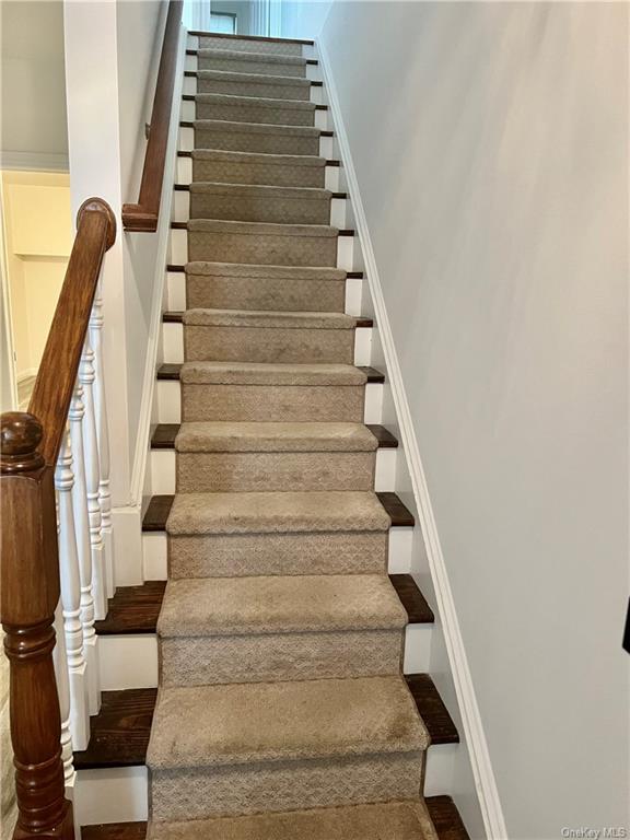 240-250 Pelham Road New Rochelle, NY 10805 - Photo 14 of 36 This home features 3 beautiful staircases. This one goes up from the main level to the 3rd floor bedrooms.