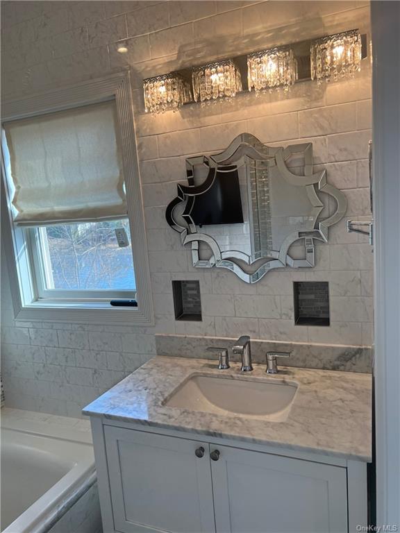 240-250 Pelham Road New Rochelle, NY 10805 - Photo 19 of 36 There's luxury all around this beautiful townhome. This the Master Bathroom (Ensuite), which features a whirlpool tub, separate shower stall and vanity.