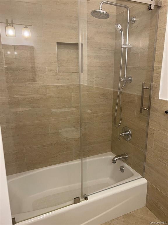 240-250 Pelham Road New Rochelle, NY 10805 - Photo 24 of 36 Another view of the Hall Bath with beautifully tiled walls and bathtub.