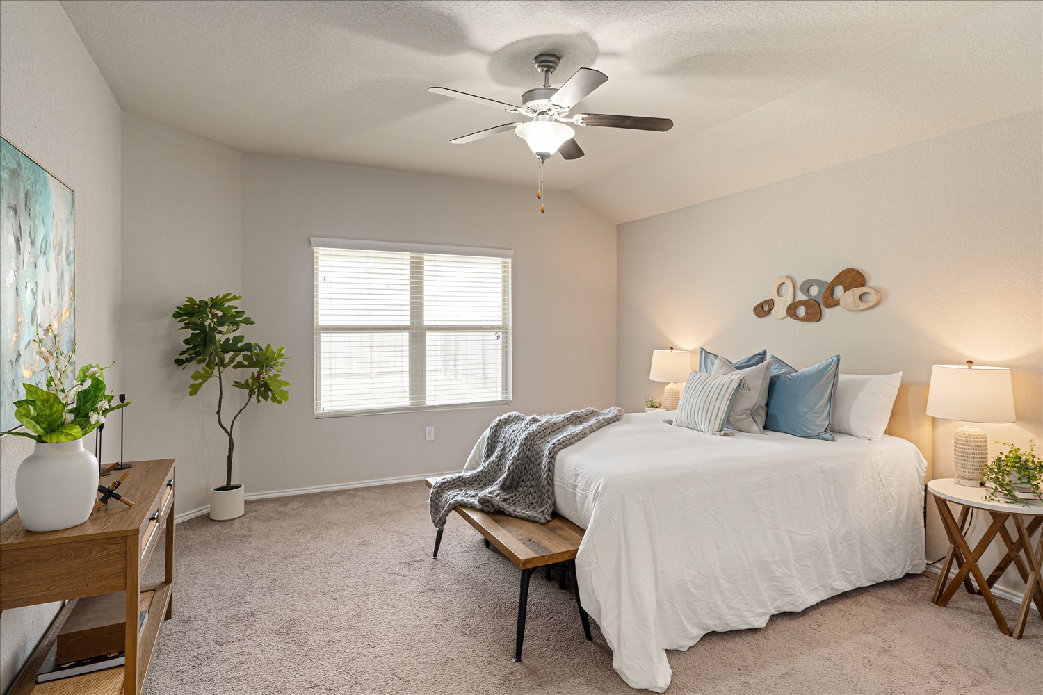 5812 Bell Tower Lane Austin, TX 78747 - Photo 12 of 24 Bedroom featuring light carpet, vaulted ceiling, and a ceiling fan