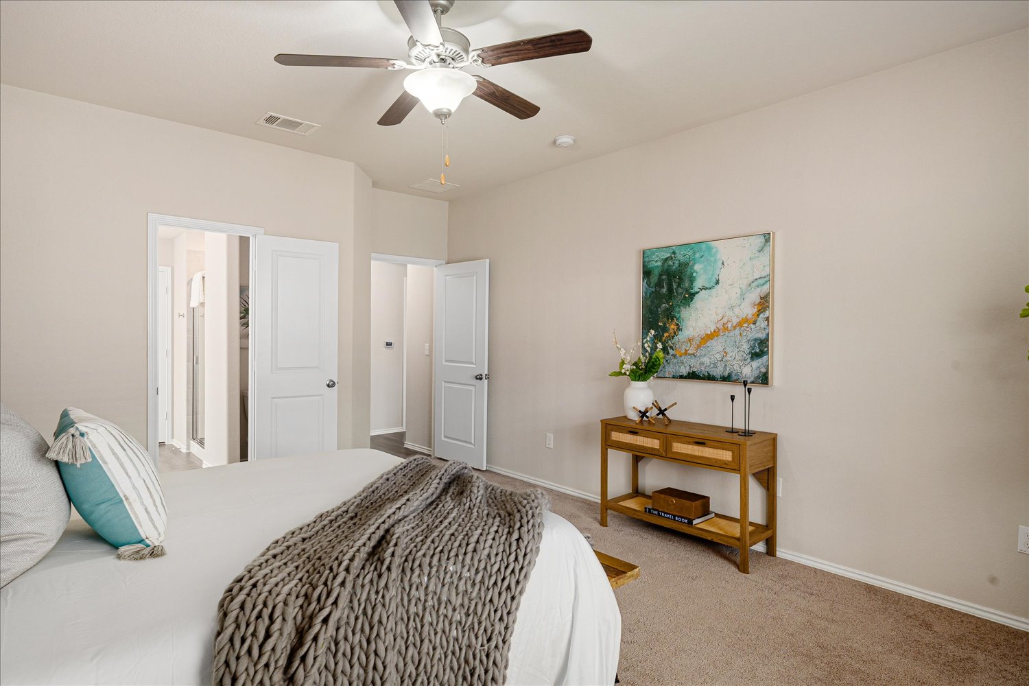 5812 Bell Tower Lane Austin, TX 78747 - Photo 13 of 24 Bedroom with light carpet and a ceiling fan