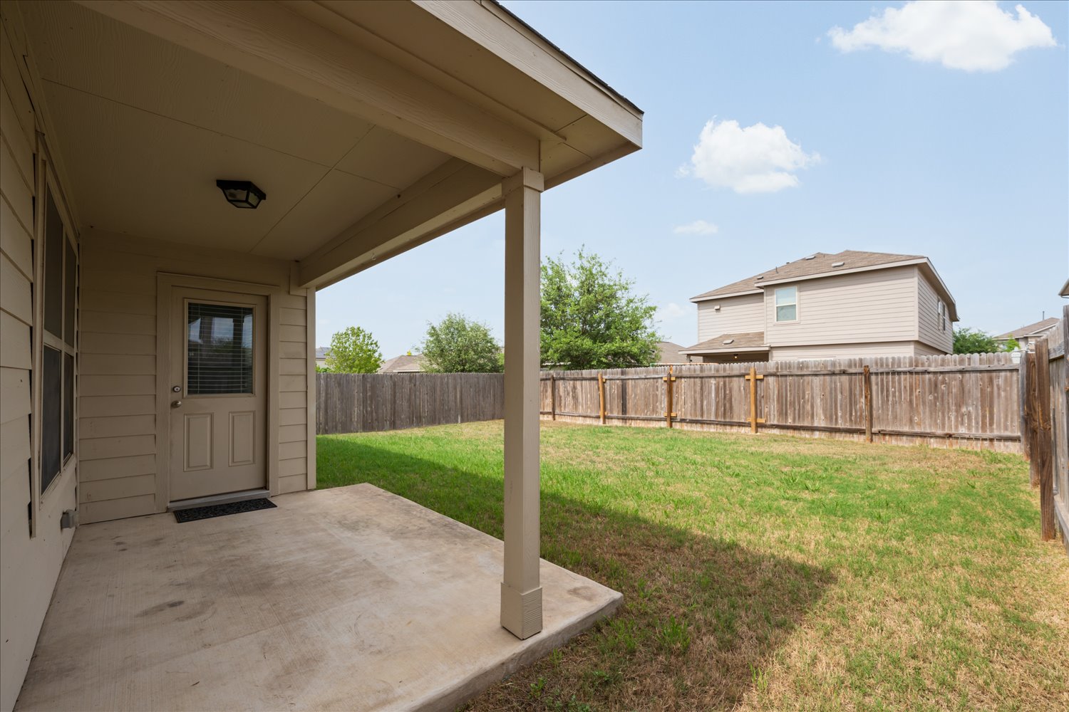 5812 Bell Tower Lane Austin, TX 78747 - Photo 22 of 24 Fenced backyard with a patio area
