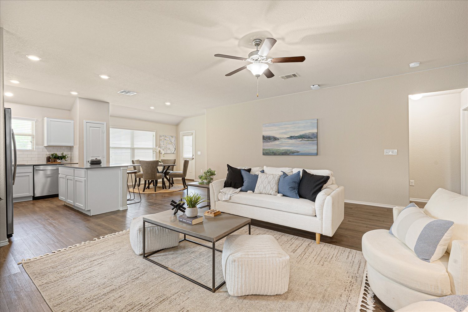 5812 Bell Tower Lane Austin, TX 78747 - Photo 3 of 24 Living room with light wood-style floors, recessed lighting, a ceiling fan, and vaulted ceiling