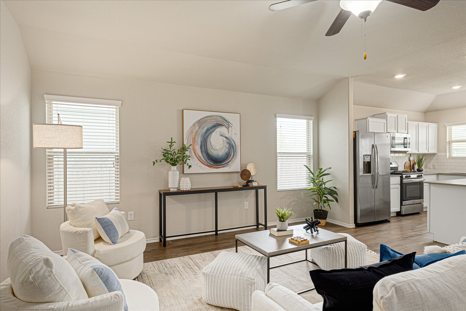 5812 Bell Tower Lane Austin, TX 78747 - Photo 6 of 24 Living area featuring lofted ceiling, ceiling fan, wood finished floors, and recessed lighting