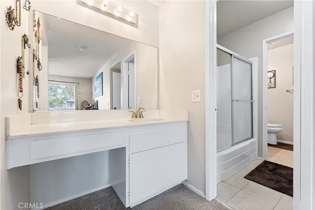 a bathroom with a shower and toilet
