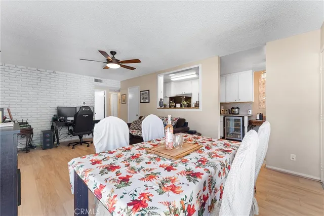 a very nice looking bedroom with a large bed a chandelier and a window