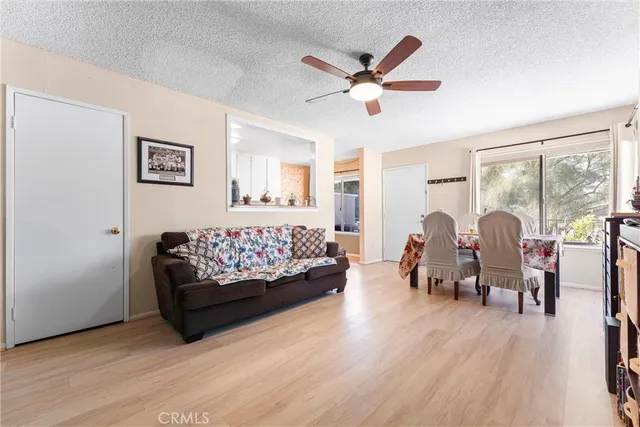 a bed room with furniture and wooden floor
