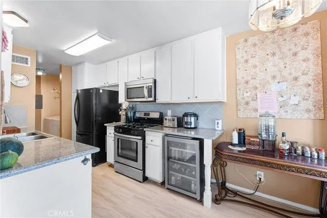 a kitchen with a sink a stove and refrigerator