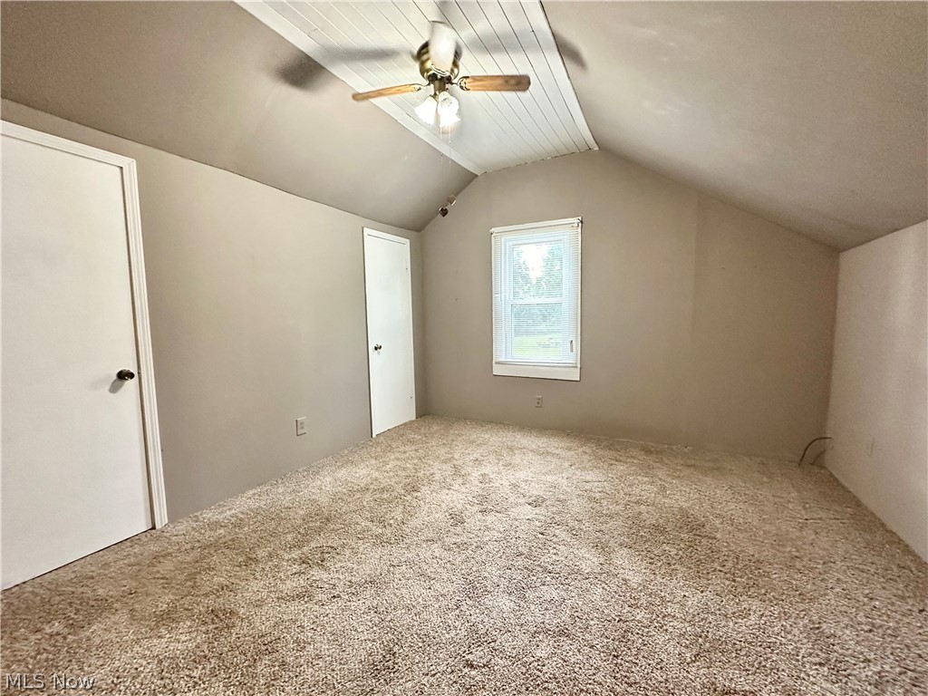 6841 Warren - Sharon Road Brookfield, OH 44403 - Photo 17 of 32 Master bedroom featuring carpet, ceiling fan, and lofted ceiling