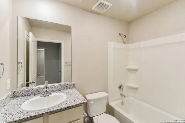 a view of a backyard with lake view