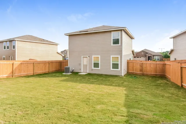 a view of a backyard with a small pool