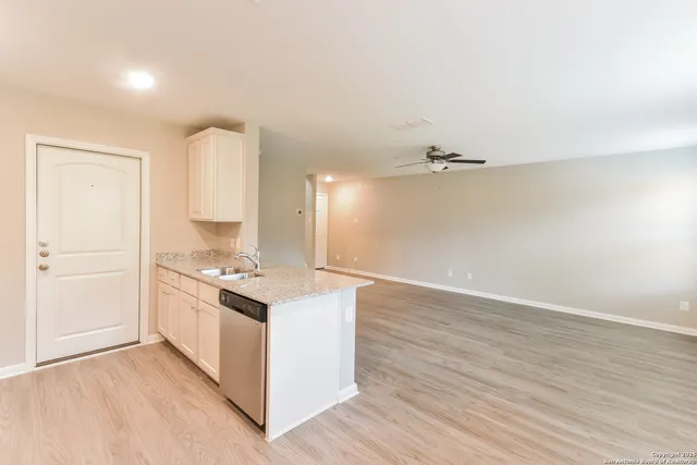 a kitchen with a stove and a refrigerator
