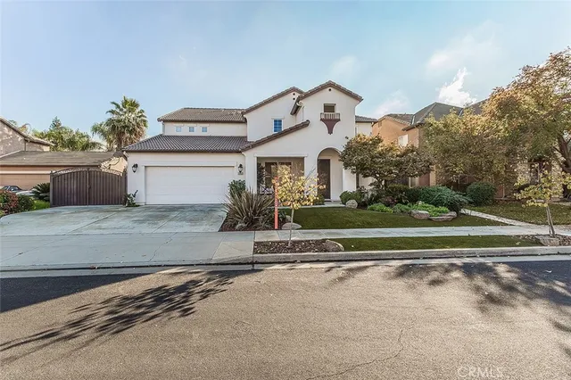 a view of a house with backyard sitting area and garden