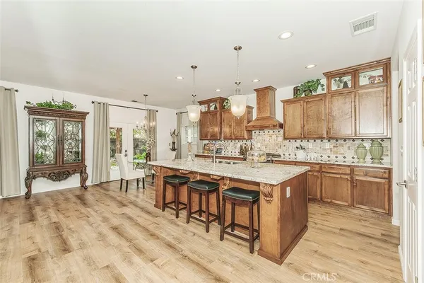 a bedroom with a bed and a potted plant