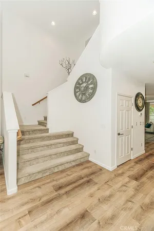 a spacious bathroom with a granite countertop sink a mirror and shower