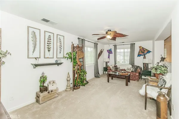 a bathroom with a granite countertop sink a mirror and shower