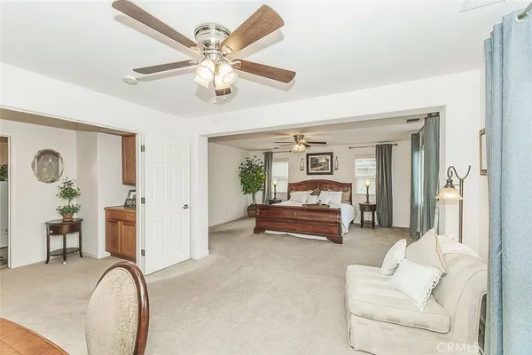 a bathroom with a granite countertop sink and a bathtub