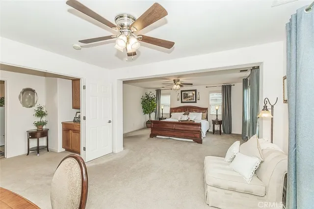 a bathroom with a granite countertop sink and a bathtub