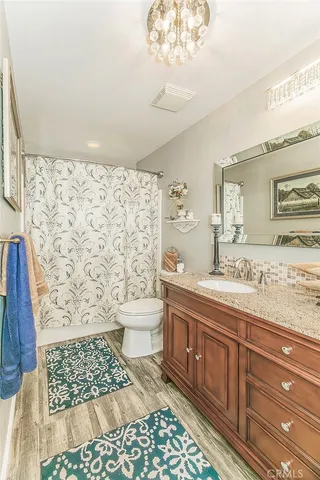 an aerial view of a house with outdoor space and lake view