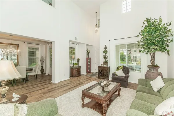a kitchen with stainless steel appliances kitchen island granite countertop a stove and a sink
