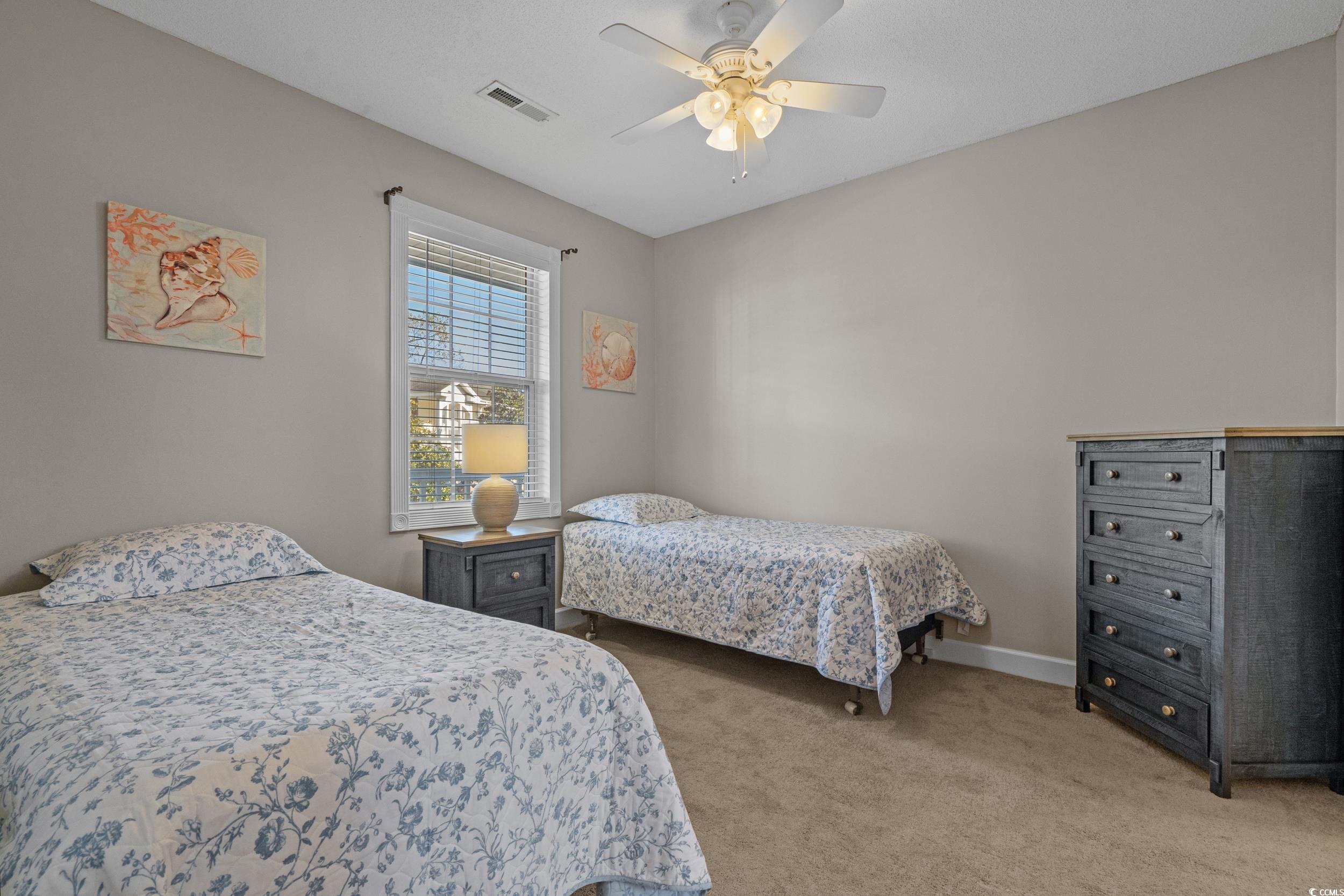 686 Riverwalk Drive, Unit 204 Myrtle Beach, SC 29579 - Photo 19 of 40 Bedroom featuring light carpet and ceiling fan