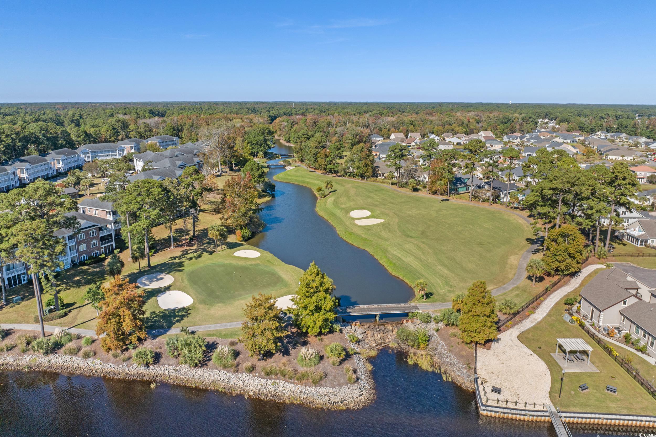 686 Riverwalk Drive, Unit 204 Myrtle Beach, SC 29579 - Photo 29 of 40 Aerial perspective of suburban area featuring a large body of water and a local golf course