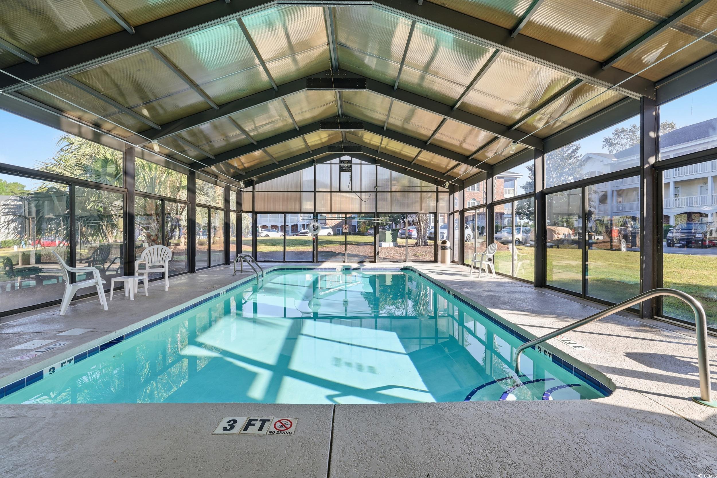 686 Riverwalk Drive, Unit 204 Myrtle Beach, SC 29579 - Photo 32 of 40 Indoor pool with a sunroom