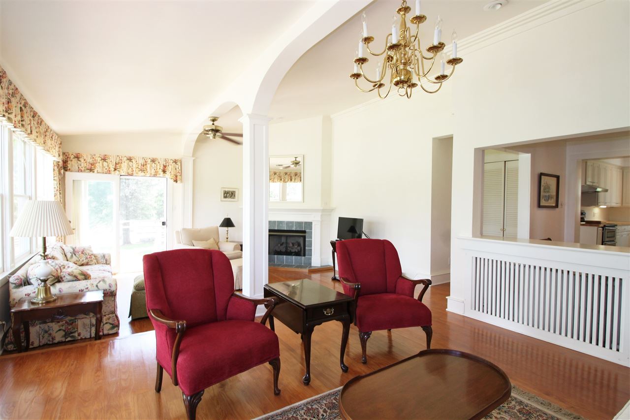 435 Baynes Road Waynesboro, VA 22980 - Photo 6 of 35 a living room with furniture a fireplace and a chandelier
