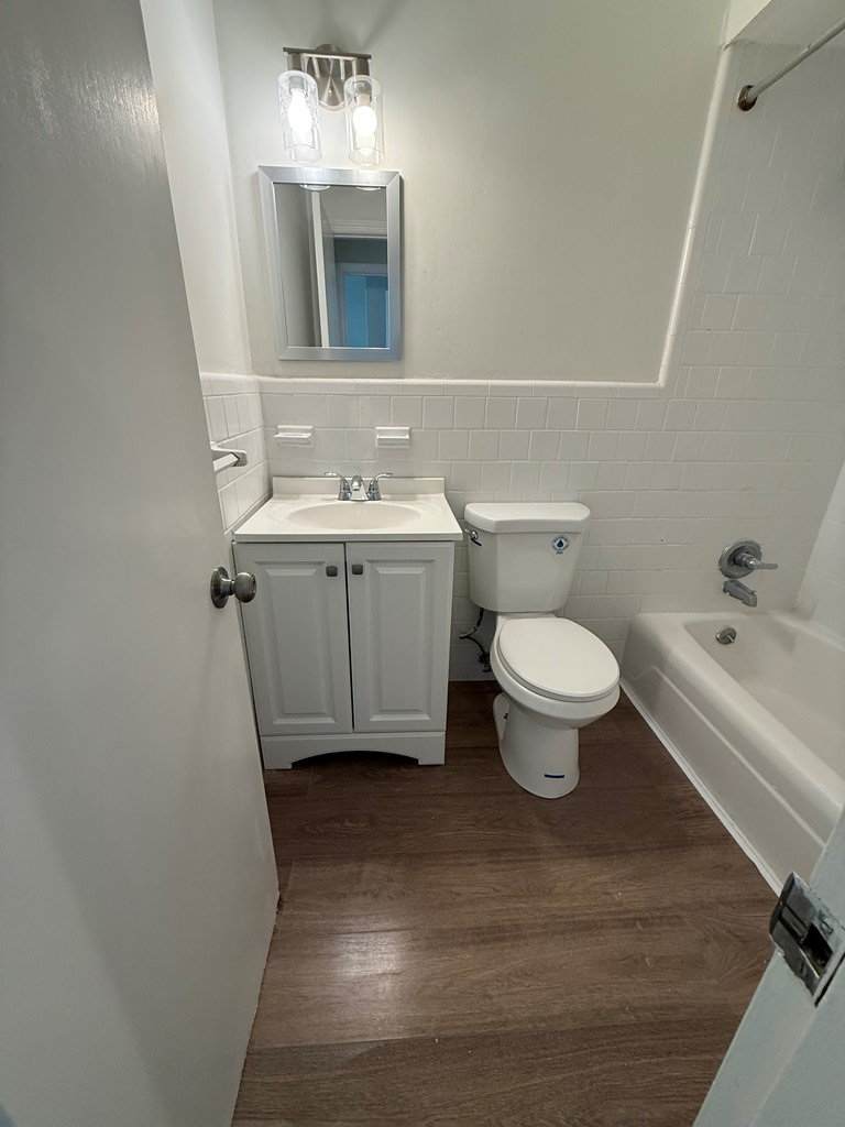 4355 Byron Street Columbus, GA 31907 - Photo 14 of 20 a bathroom with a sink toilet and a mirror