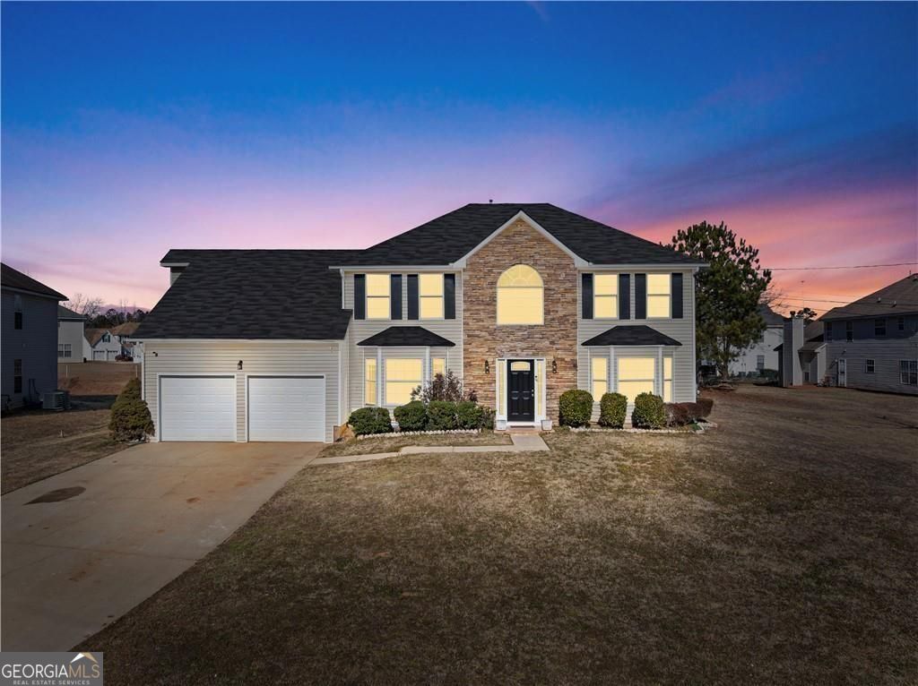 a front view of a house with a yard