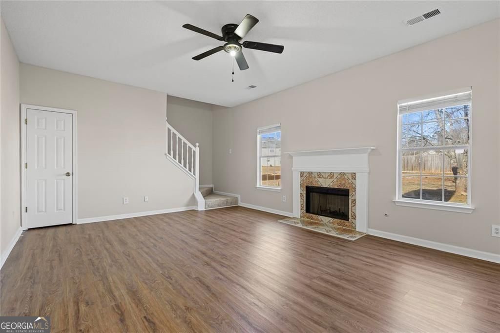 2320 Highbank Court Decatur, GA 30035 - Photo 12 of 27 a view of an empty room with wooden floor fireplace and a window