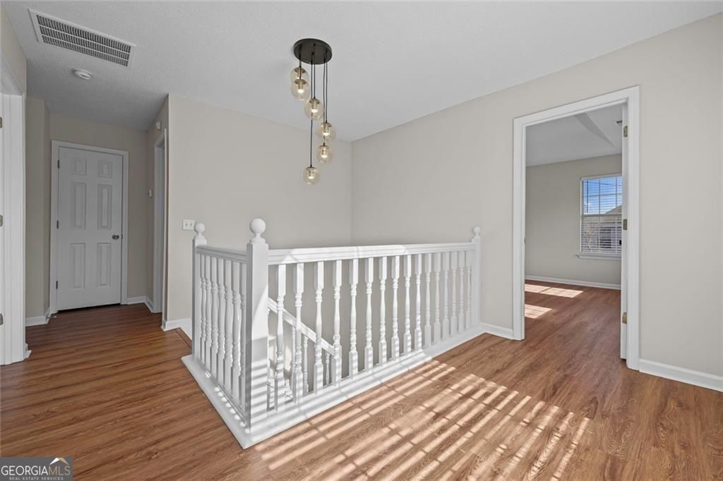 2320 Highbank Court Decatur, GA 30035 - Photo 16 of 27 a view of a hallway view with wooden floor and staircase