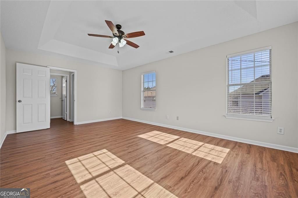 2320 Highbank Court Decatur, GA 30035 - Photo 17 of 27 a view of an empty room with wooden floor and a window