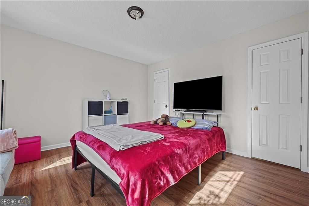 2320 Highbank Court Decatur, GA 30035 - Photo 26 of 27 a bedroom with a bed and a flat screen tv