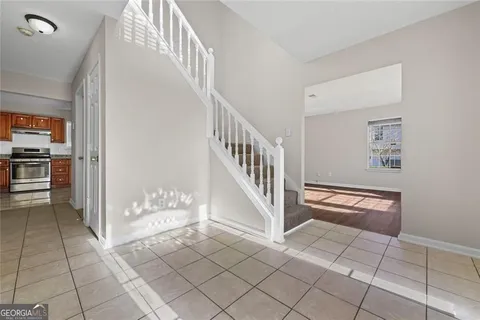 a view of entryway and hall with a living room