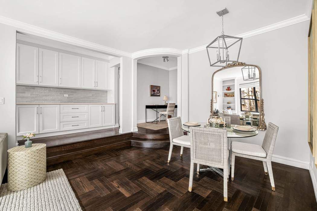 225 East 74th Street, Unit 2M Manhattan, NY 10021 - Photo 4 of 16 a view of a dining room with furniture